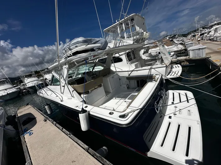  Yacht Photos Pics 2005 Tiara Yachts 3200 Open docked at marina under clear blue sky.