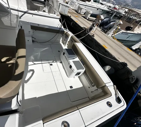  Yacht Photos Pics 2005 Tiara Yachts 3200 Open boat deck with seating and cooler at marina.