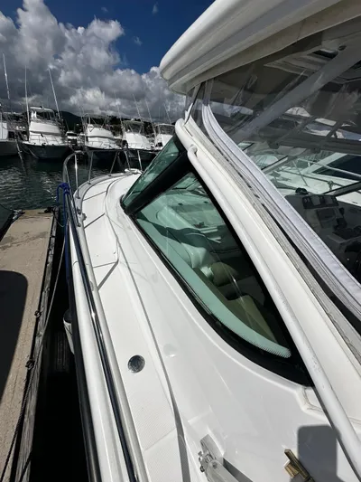  Yacht Photos Pics 2005 Tiara Yachts 3200 Open docked, showcasing sleek design and spacious deck.