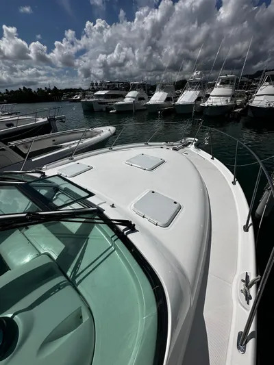  Yacht Photos Pics 2005 Tiara Yachts 3200 Open docked in a marina under cloudy skies.