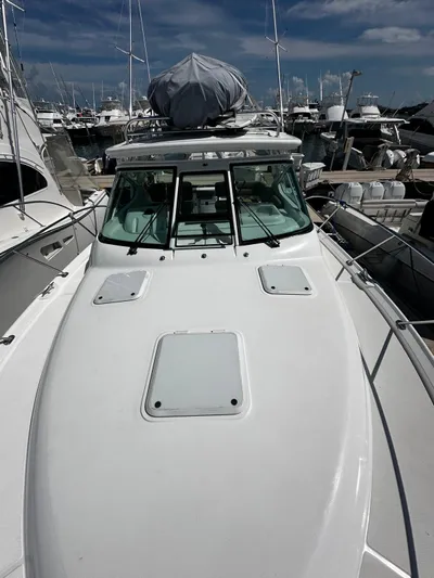  Yacht Photos Pics 2005 Tiara Yachts 3200 Open boat docked in marina under clear sky.