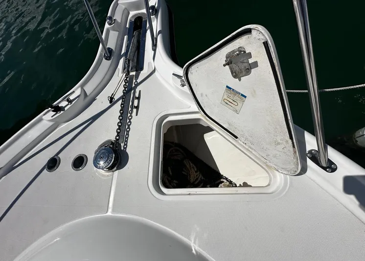  Yacht Photos Pics Tiara Yachts 3200 Open 2005 anchor locker with open hatch and chain.