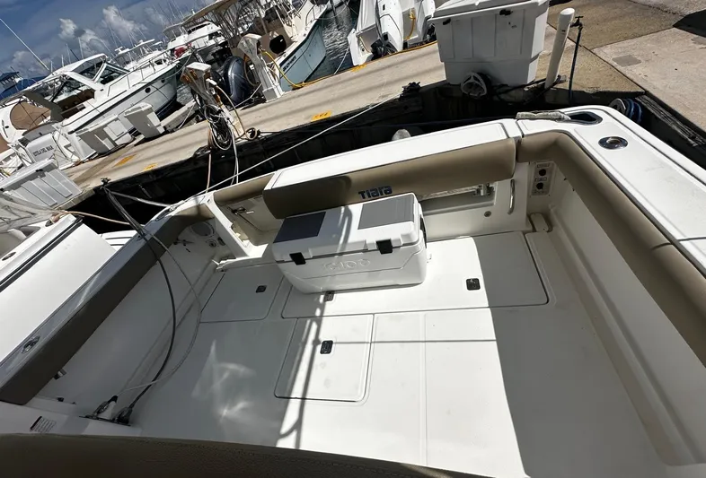  Yacht Photos Pics 2005 Tiara Yachts 3200 Open boat deck with seating and cooler at marina.