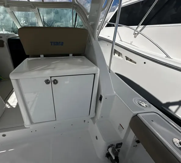  Yacht Photos Pics 2005 Tiara Yachts 3200 Open interior with seating and storage cabinet.