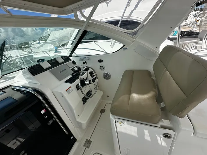  Yacht Photos Pics 2005 Tiara Yachts 3200 Open helm with beige seating and modern controls.