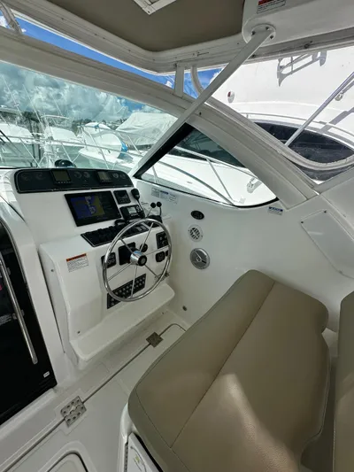  Yacht Photos Pics 2005 Tiara Yachts 3200 Open helm with steering wheel and navigation controls.