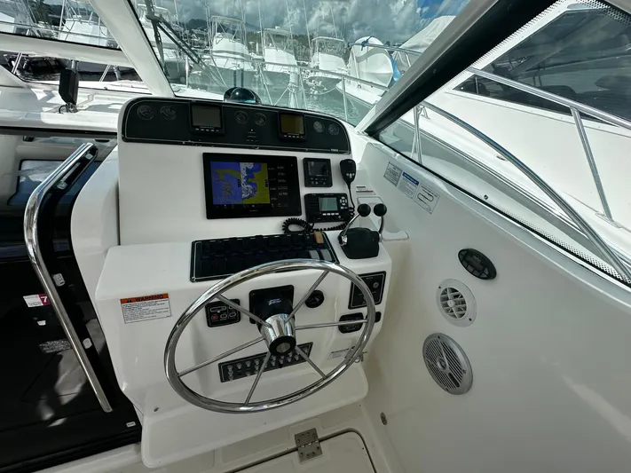  Yacht Photos Pics 2005 Tiara Yachts 3200 Open helm with navigation controls and steering wheel.