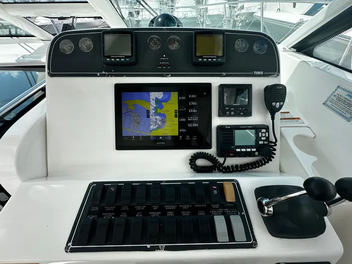  Yacht Photos Pics Control panel of a 2005 Tiara Yachts 3200 Open, featuring navigation and communication equipment.