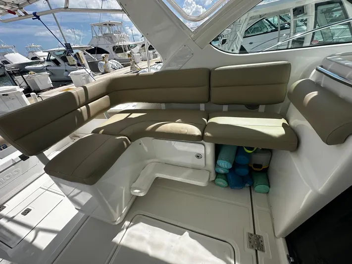  Yacht Photos Pics 2005 Tiara Yachts 3200 Open interior with beige seating and marina view.