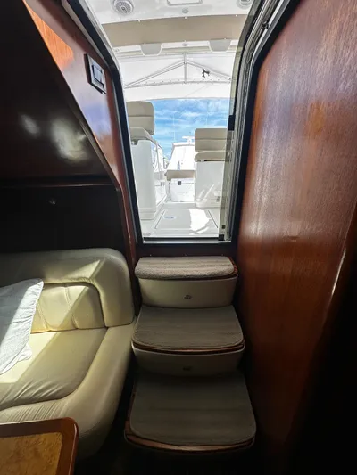  Yacht Photos Pics Interior view of 2005 Tiara Yachts 3200 Open, showing cabin stairs and seating.