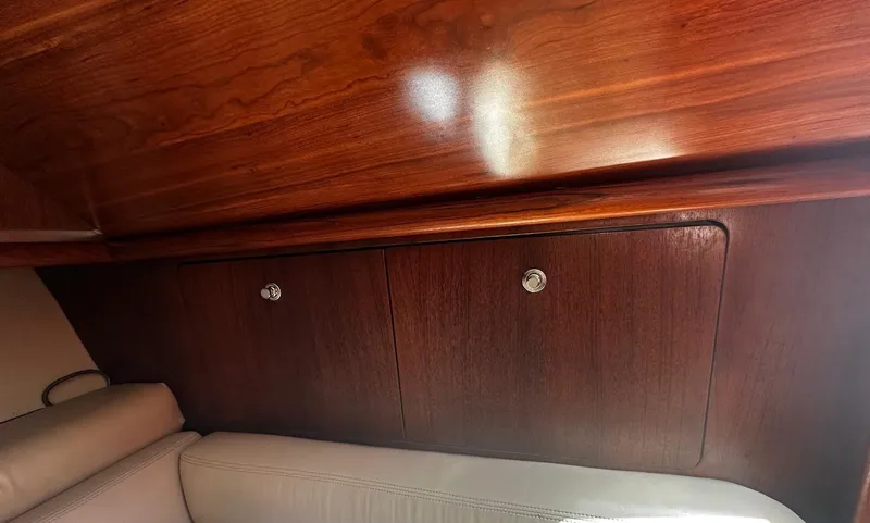  Yacht Photos Pics Interior of 2005 Tiara Yachts 3200 Open, featuring elegant wooden cabinetry and seating.
