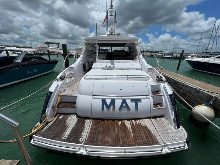 Mat Yacht Photos Pics 2009 Princess V58 yacht docked at marina under cloudy sky.