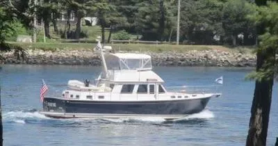 Swamp Fox Yacht Photos Pics 2001 Sabre Sabreline 47 yacht cruising on a calm river.
