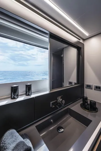 Our Trade Yacht Photos Pics Luxury bathroom interior on 2023 Pershing 6X yacht with ocean view.