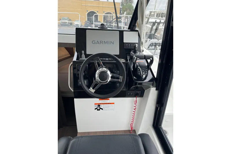  Yacht Photos Pics Helm of 2025 Jeanneau NC 895 Sport Series 2 with Garmin navigation system.