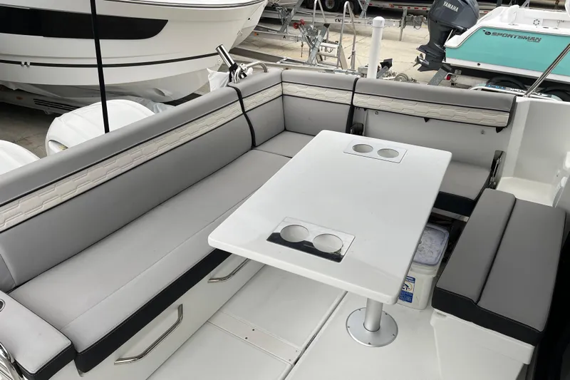  Yacht Photos Pics 2025 Jeanneau NC 895 Sport Series 2 boat interior with seating and table.