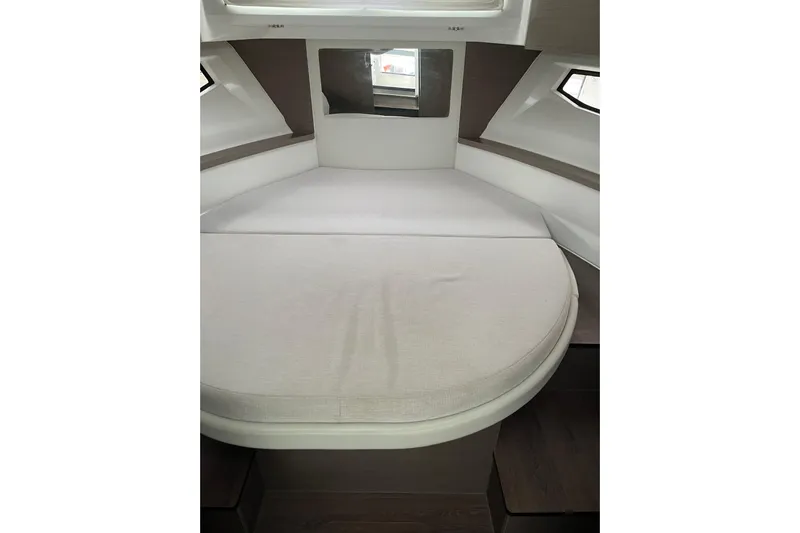 Yacht Photos Pics 2025 Jeanneau NC 895 Sport Series 2 cabin interior with bed and windows.