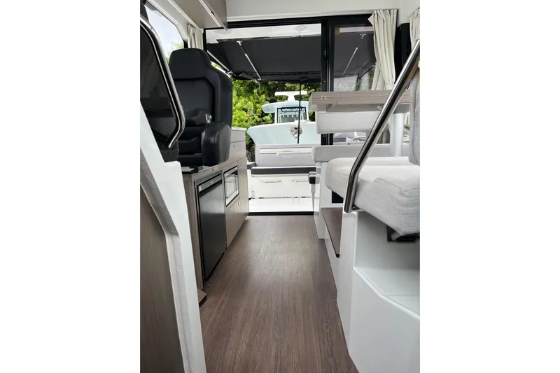  Yacht Photos Pics Interior of 2025 Jeanneau NC 895 Sport Series 2, featuring modern seating and sleek design.