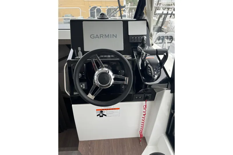  Yacht Photos Pics 2025 Jeanneau NC 895 Sport Series 2 helm with Garmin navigation system.