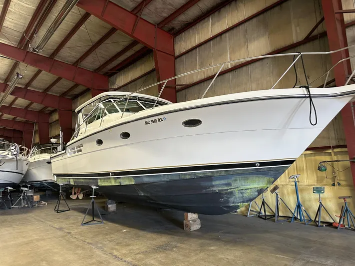 Superfishal II Yacht Photos Pics 1999 Tiara Yachts 4100 Open in storage, showcasing sleek design and sturdy build.