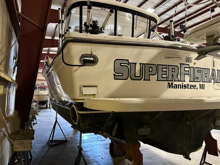 Superfishal II Yacht Photos Pics 1999 Tiara Yachts 4100 Open in storage, labeled "SuperFish" from Manistee, MI.