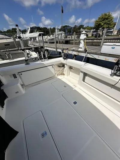 Superfishal II Yacht Photos Pics 1999 Tiara Yachts 4100 Open boat deck at marina, clear sky, calm water.