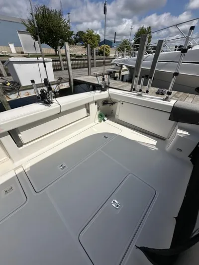 Superfishal II Yacht Photos Pics 1999 Tiara Yachts 4100 Open boat deck with fishing rod holders, docked at marina.