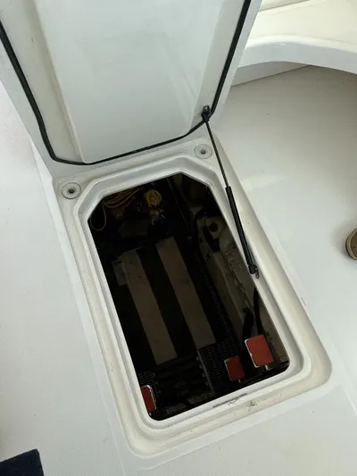 Superfishal II Yacht Photos Pics 1999 Tiara Yachts 4100 Open engine compartment with open hatch.