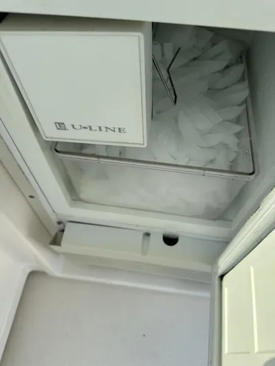 Superfishal II Yacht Photos Pics U-Line ice maker inside a 1999 Tiara Yachts 4100 Open, filled with ice cubes.