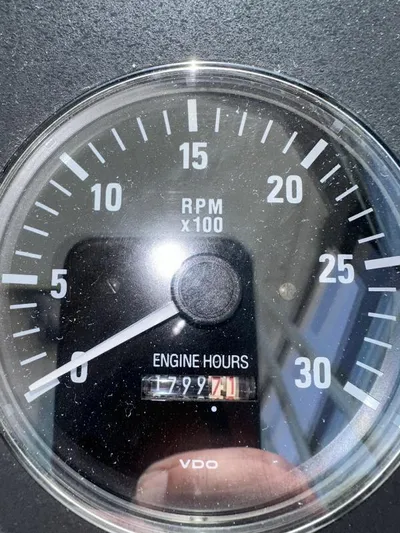 Superfishal II Yacht Photos Pics Close-up of Tiara Yachts 4100 Open 1999 tachometer showing 1799.7 engine hours.