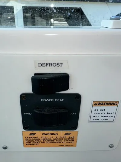 Superfishal II Yacht Photos Pics 1999 Tiara Yachts 4100 Open control panel with defrost and power seat switches.