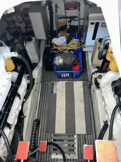 Superfishal II Yacht Photos Pics Engine room of a 1999 Tiara Yachts 4100 Open, featuring equipment and storage.