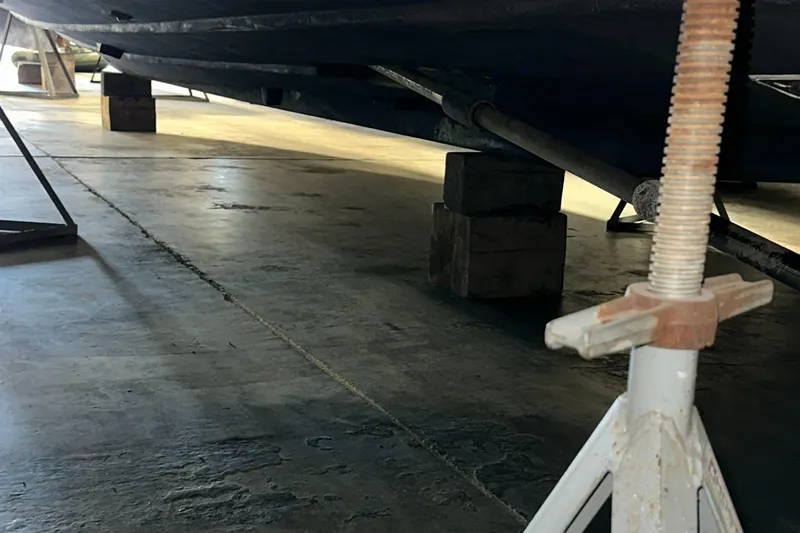 Superfishal II Yacht Photos Pics 1999 Tiara Yachts 4100 Open on blocks in a maintenance facility.