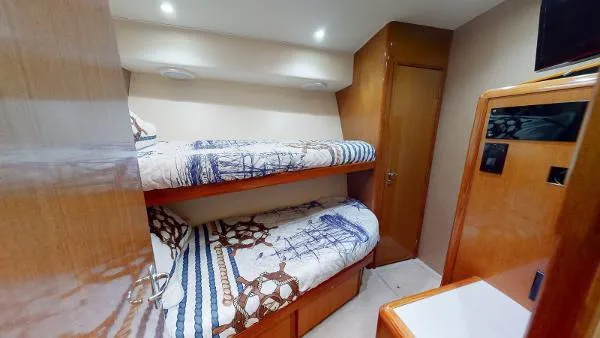 Reel Blonde Yacht Photos Pics 1999 Viking 72 Sport Fish cabin with bunk beds and wooden interior.