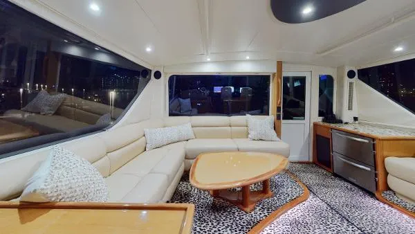 Reel Blonde Yacht Photos Pics Luxurious interior of a 1999 Viking 72 Sport Fish yacht with modern furnishings.