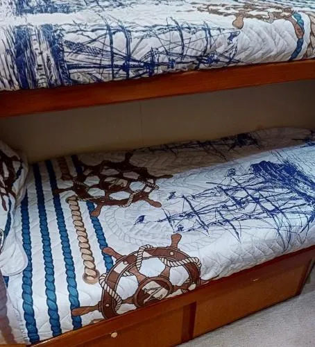 Reel Blonde Yacht Photos Pics Bunk beds with nautical-themed bedding on a 1999 Viking 72 Sport Fish yacht.