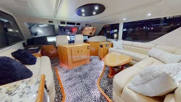 Reel Blonde Yacht Photos Pics Luxurious interior of a 1999 Viking 72 Sport Fish yacht with plush seating and modern decor.