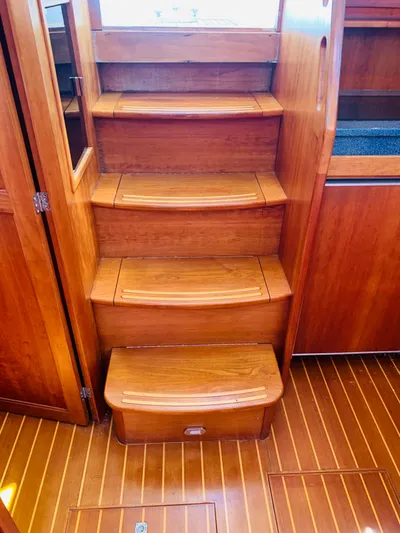 Sparrow Yacht Photos Pics Wooden interior stairs of 2004 Sabre 42 Hardtop Express yacht.