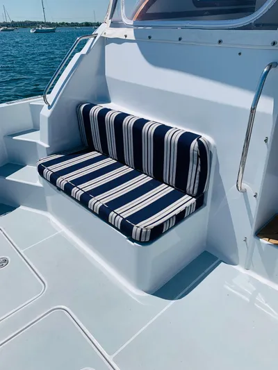 Sparrow Yacht Photos Pics Striped seating on 2004 Sabre 42 Hardtop Express yacht deck.