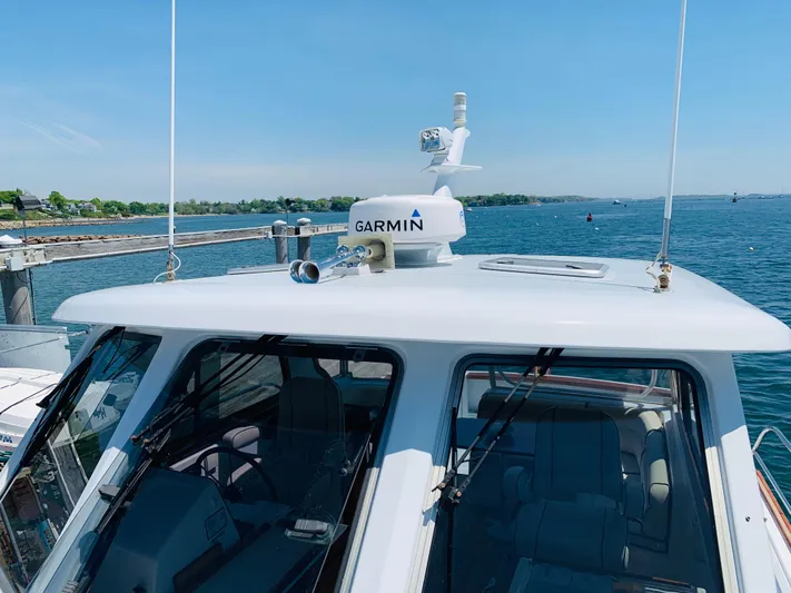 Sparrow Yacht Photos Pics 2004 Sabre 42 Hardtop Express with Garmin radar on a sunny day at sea.