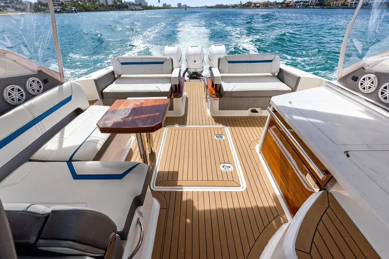Knot Sorry Yacht Photos Pics 2022 Tiara Yachts 38 LX interior with luxurious seating and ocean view.