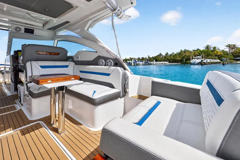 Knot Sorry Yacht Photos Pics 2022 Tiara Yachts 38 LX interior with luxurious seating and ocean view.