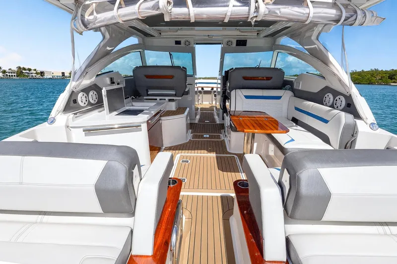 Knot Sorry Yacht Photos Pics 2022 Tiara Yachts 38 LX interior with luxurious seating and modern amenities on the water.