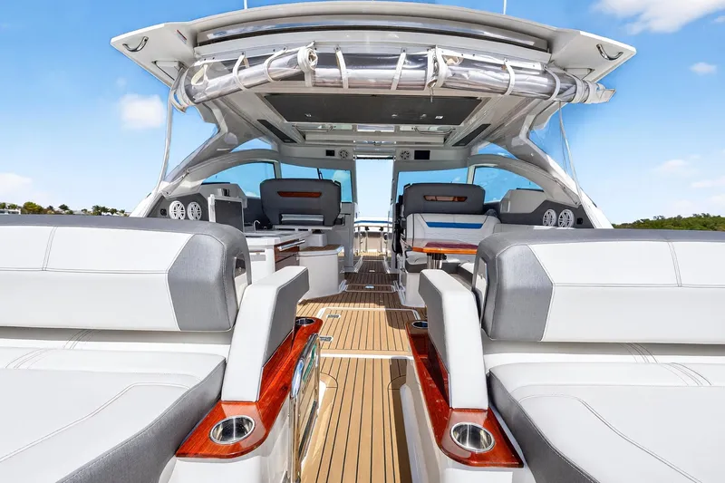 Knot Sorry Yacht Photos Pics 2022 Tiara Yachts 38 LX interior with luxurious seating and sleek design.