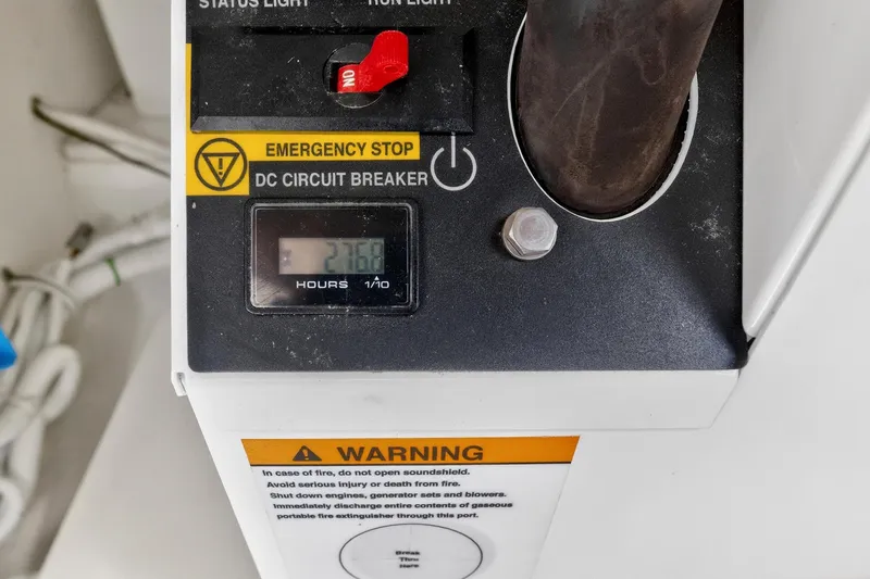 Knot Sorry Yacht Photos Pics Tiara Yachts 38 LX 2022 control panel with emergency stop and hour meter.