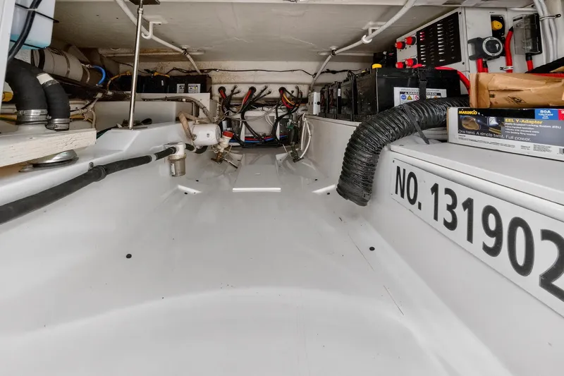 Knot Sorry Yacht Photos Pics 2022 Tiara Yachts 38 LX engine compartment with wiring and equipment.