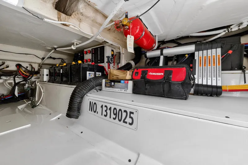 Knot Sorry Yacht Photos Pics Engine compartment of 2022 Tiara Yachts 38 LX with tools and equipment.