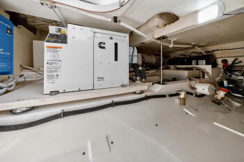 Knot Sorry Yacht Photos Pics Engine room of 2022 Tiara Yachts 38 LX, featuring Onan Marine generator.