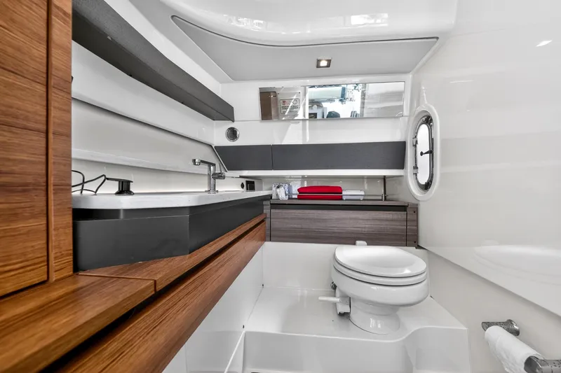 Knot Sorry Yacht Photos Pics Luxurious bathroom interior of 2022 Tiara Yachts 38 LX, featuring modern fixtures and elegant design.