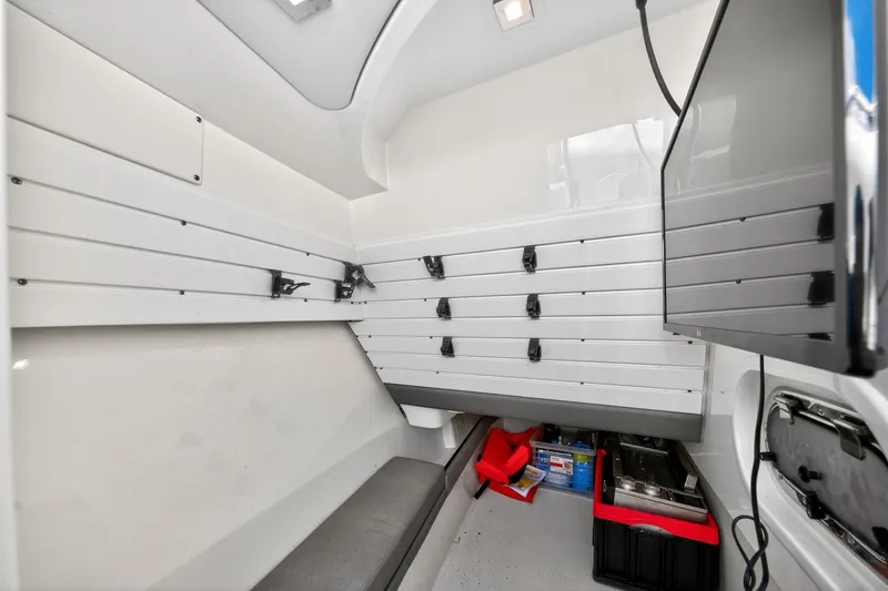 Knot Sorry Yacht Photos Pics Interior of 2022 Tiara Yachts 38 LX, featuring storage and seating area.